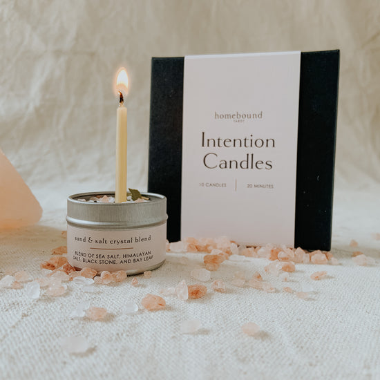 intention candle box and candle burning in a salt pot by homebound tarot
